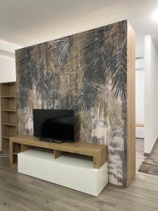a living room with a flat screen tv on a wall at Nova Stay in Rome