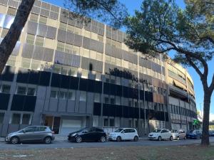 a building with cars parked in front of it at Nova Stay in Rome