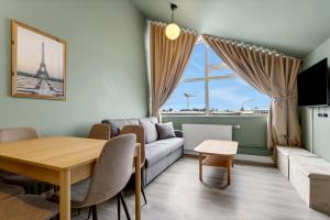 a living room with a couch and a table at ASKA Hraun in Hafnarfjörður +67 photos
