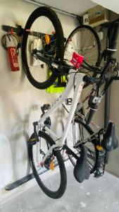 a bike is hanging on a wall at Studio Saint Julien de Concelles 5 minutes de la Loire in Saint-Julien-de-Concelles