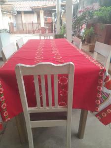 a table with a red table cloth on top of it at Tata Róga in Asunción
