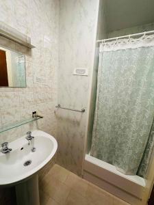 a bathroom with a sink and a shower at Ride Side Delton Hotel in Blackpool +33 photos