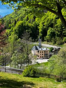 a large building with a church on a hill at Albergo Brustolon in Dont