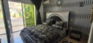 a bedroom with a large bed in a room at Maison du prince in Yasmine +23 photos