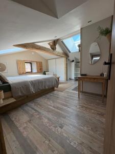 a bedroom with a bed and a skylight at Chambre K-arole in Pouzauges