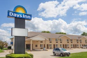 a days inn sign in front of a building at Days Inn by Wyndham Charleston in Charleston