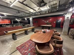 a room with a wooden table and chairs in it at A12 Gallant Fox B02 Suite in Louisville