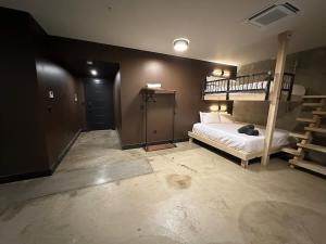 a bedroom with a bunk bed and a staircase at A12 Gallant Fox B02 Suite in Louisville +3 photos