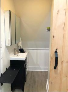 a small bathroom with a sink and a mirror at Sunset n Chill in Sunset Beach