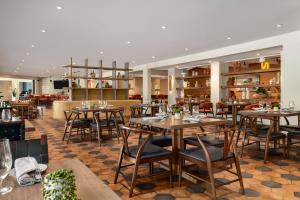 a restaurant with tables and chairs and a bar at Outbound Sedona in Sedona