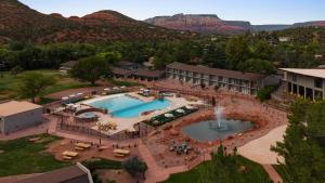an aerial view of a resort with a pool and mountains at Outbound Sedona in Sedona