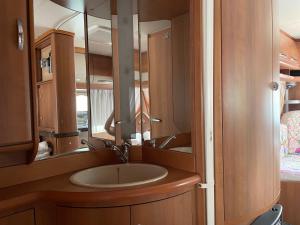 a bathroom with a sink and a mirror at SeaHouse Pakoštane - Hobby in Pakoštane +45 photos