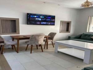 a living room with a table and a couch at Horizon Relax in Mohammedia