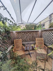 two chairs and a table on a patio at Cambridge city centre immaculate 2 bed apartment in Cambridge