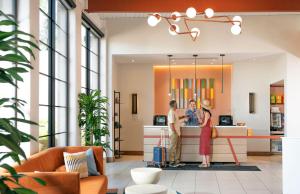 two people standing at a counter in a lobby at Outbound Sedona in Sedona +65 photos