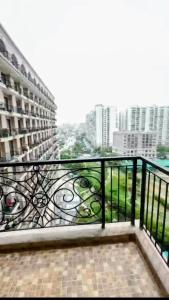 a balcony with a view of a city at Omaxe Hazratganj Stay in Lucknow