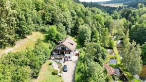 an aerial view of a house in the middle of a forest at Ferienwohnung Sankt Hubertus in Bad Berneck im Fichtelgebirge
