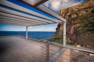 a balcony with a view of the ocean at Appartamento Tramonto in Castelsardo
