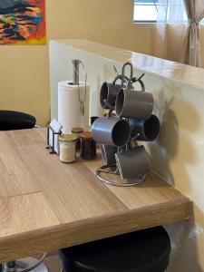 a table with a bunch of coffee cups on it at Flor de Naranjo in Tabacundo