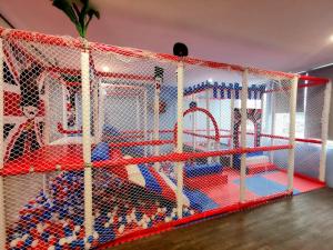 a play room with a large play structure at Hotel Wow Penang in George Town