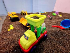a childs toy truck with a sandbox at Hotel Wow Penang in George Town +7 photos