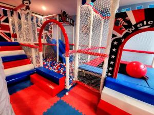 a kids play room with a climbing net and balls at Hotel Wow Penang in George Town