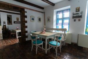 a dining room with a table and some chairs at Matejev konak in Šušara +44 photos