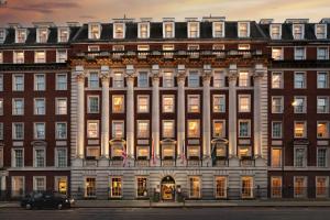 a large brick building with many windows at The Biltmore Mayfair in London