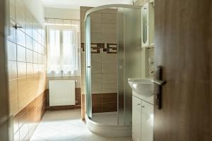 a bathroom with a shower and a sink at Pension Gábi in Františkovy Lázně +70 photos