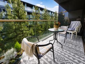 a balcony with a table and chairs on a building at Beacon Guest Rooms Sandyford in Sandyford