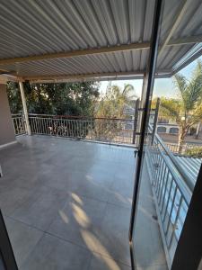 a view of a balcony with a metal roof at RIER Guesthouse in Pretoria