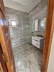 a bathroom with a shower and a sink at Riad Rabat Laalou in Rabat +36 photos