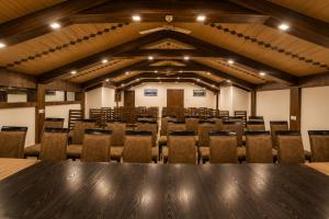 an empty conference room with a table and chairs at The Valley View in Srinagar