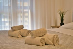 two towels on a bed in a hotel room at Renzo e Lucia - la Terrazza Panoramica in Barzio