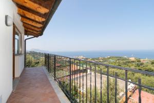 a balcony with a view of the ocean at Limoneto by Espresso Rentals in Massa Lubrense