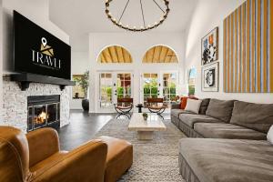 a living room with a couch and a fireplace at NEW Royal Palms Retreat with Pool Spa & Pool Table in Tempe +26 photos