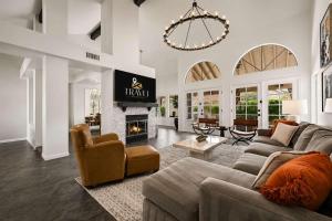 a living room with a couch and a fireplace at NEW Royal Palms Retreat with Pool Spa & Pool Table in Tempe
