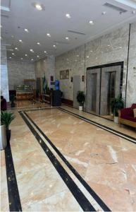 a bowling alley with a bowling alley in a building at فندق كرمك اجياد السد in Ajyad
