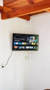 a flat screen tv hanging on a wall at Miniloft Centrico in El Calafate