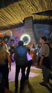 a group of people standing on a dance floor at Wood & Net in Iringa