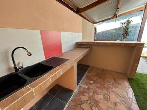 a kitchen with a sink and a window at Villa R-A in Kourou +11 photos