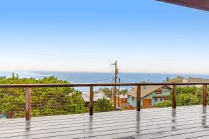 a balcony with a view of the ocean at The Nook on Chinook in Tillamook