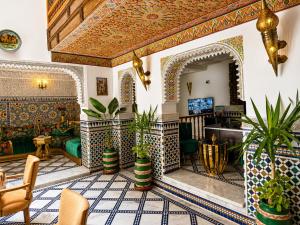 a lobby of a hotel with a tile patterned ceiling at Riad Dar ElBellar in Fez