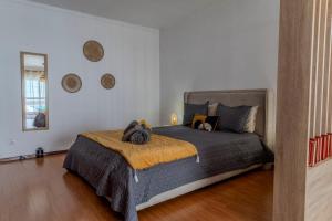 a bedroom with a bed in a room at Canto Celeste in Alcobaça +25 photos