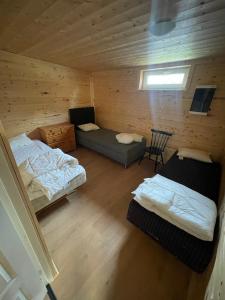 an overhead view of a room with two beds and a couch at Room 2 in Hästveda