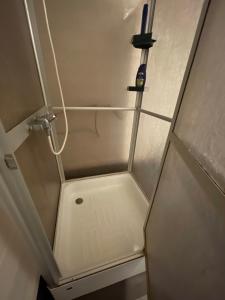 a small shower in a room with a shower at Room 2 in Hästveda