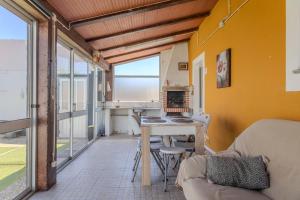 a living room with a table and a couch at Canto Celeste in Alcobaça