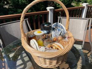 a basket on a glass table with food in it at Lehmann House Bed & Breakfast in Saint Louis