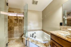 a bathroom with a tub and a shower and a sink at Brian Head 'View-Topia' w/ Mtn Views & King Suite in Brian Head +28 photos