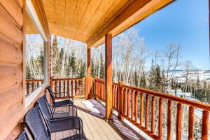 a porch with two chairs and a view of the mountains at Brian Head 'View-Topia' w/ Mtn Views & King Suite in Brian Head